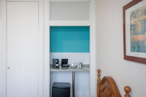 a door into a room with a blue window at Hotel Moon Dreams Mediterráneo in Torremolinos