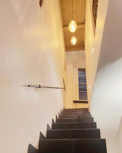 a staircase in a building with black stairs at ACQUARIO 11 in Genova