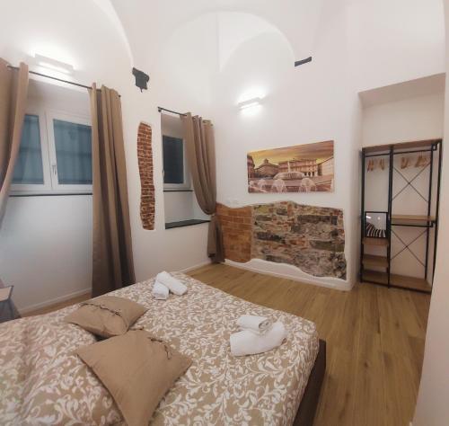 a bedroom with a bed and a fireplace at ACQUARIO 11 in Genova