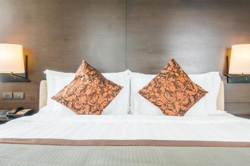 Postel nebo postele na pokoji v ubytování Hotel Varchu