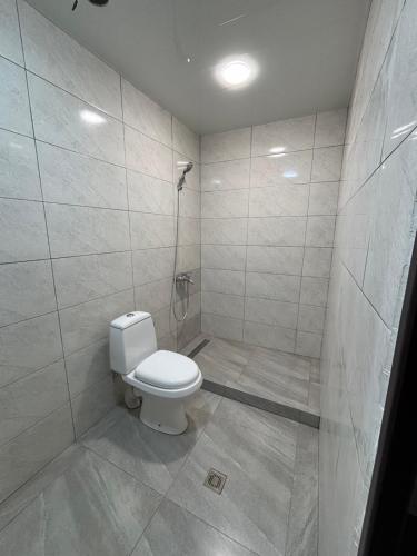 a bathroom with a toilet and a shower at Gyumri Home in Gyumri