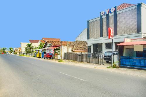 an empty street in a small town with buildings at Dancenter Z Hotel in Bandar Lampung