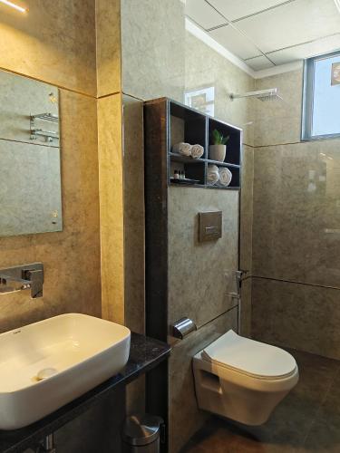 a bathroom with a toilet and a sink at Sagar Stays in Jaipur