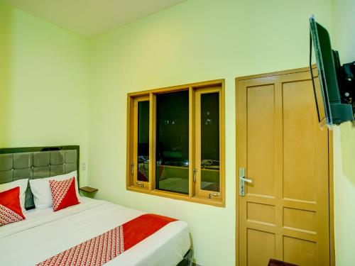 Postel nebo postele na pokoji v ubytování Dancenter Pudan Residence 2