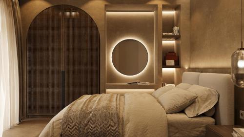 a bedroom with a bed and a round mirror at 12 Islands Villas in Kolimbia