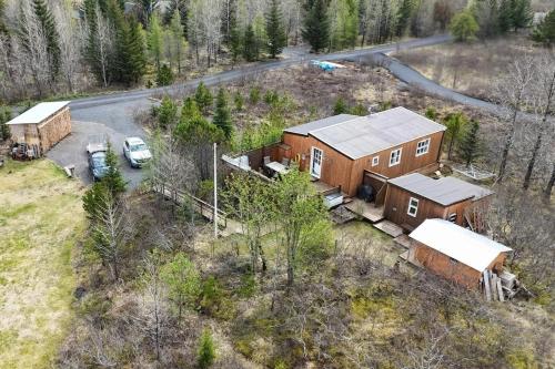 an aerial view of a house in the woods at Spacious Summerhouse with Hot Tub & Garden in Selfoss