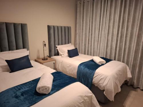 Ένα ή περισσότερα κρεβάτια σε δωμάτιο στο Bliss Ballito Apartment