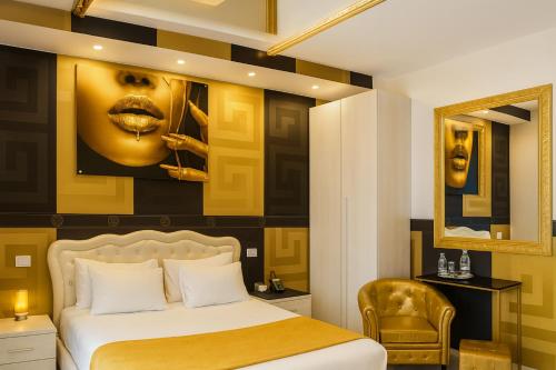 a bedroom with a bed with a yellow and black wall at Bed Cinecitta’ in Rome