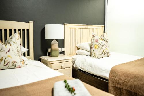 Postel nebo postele na pokoji v ubytování Padlangs Self-catering flats