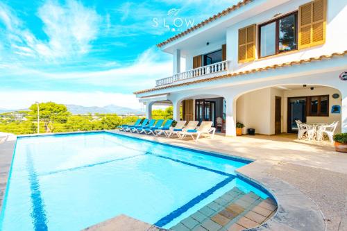 a villa with a swimming pool and a house at Villa Monsita by Slow Villas in Santa Ponsa