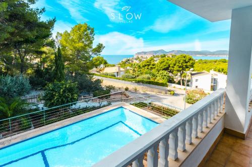 una vista dal balcone di una casa con piscina di Villa Monsita by Slow Villas a Santa Ponsa