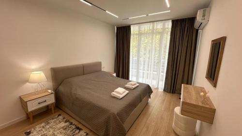 Postelja oz. postelje v sobi nastanitve Doris Apartment