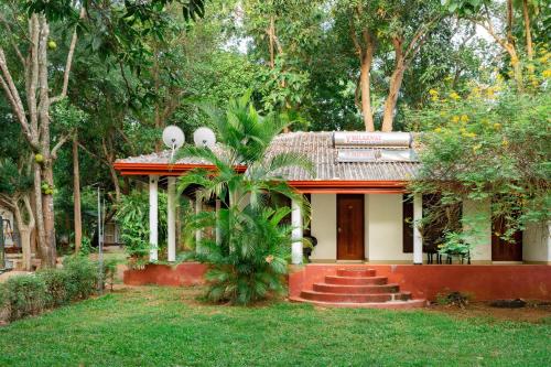a small house in the middle of a forest at JC's Village in Dambulla