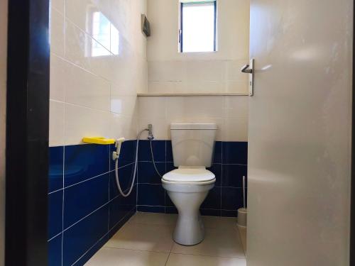 a bathroom with a toilet and a shower at R Garden Fleury Sur Mer Trou aux Biches in Trou aux Biches
