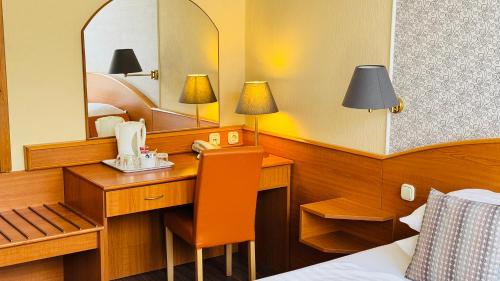 Voodi või voodid majutusasutuse Hotel Orion toas