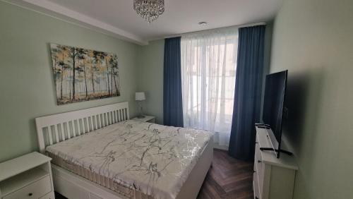 Ένα ή περισσότερα κρεβάτια σε δωμάτιο στο Audronašos apartamentai - self cheking- Gargžduose