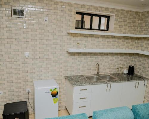 Kuchyň nebo kuchyňský kout v ubytování Igitego Boutique Hotel LTD