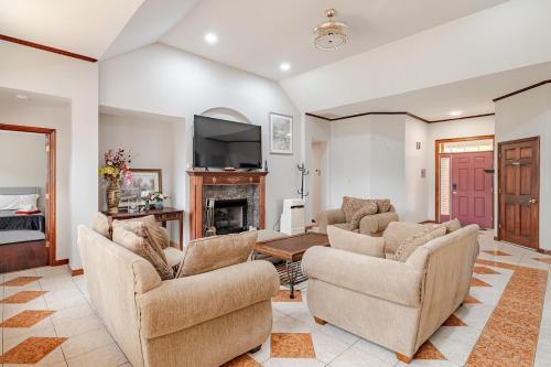 a living room with two chairs and a fireplace at Nirav in Winston-Salem