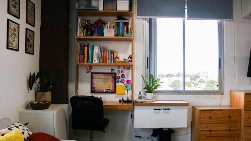 an office with a desk and a computer in a room at The Alexa tiny apartment city view in San Juan