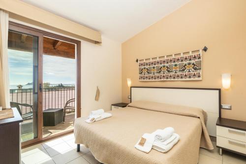 Una cama o camas en una habitación de B&B Portu Cuau