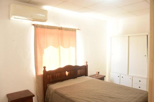 Postel nebo postele na pokoji v ubytování La Casita