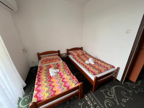 Postel nebo postele na pokoji v ubytování Motel Arena