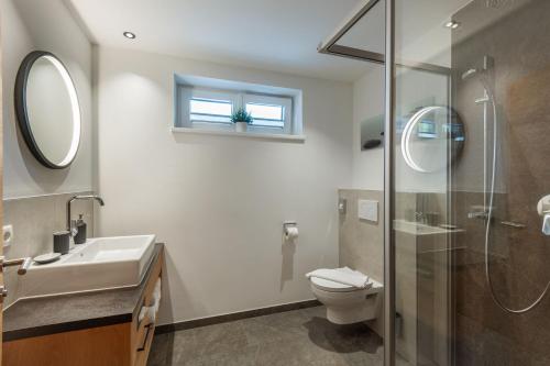 Ein Badezimmer in der Unterkunft Appartements ALMA