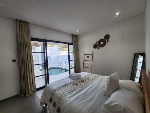 Ένα ή περισσότερα κρεβάτια σε δωμάτιο στο Villa Casa de Coco at Lovina