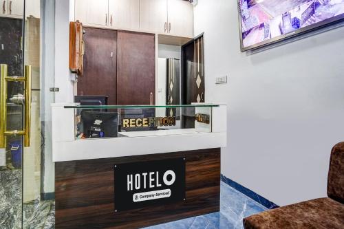 a hotel room lobby with a glass display case at Super Hotel O Brilliant Convention Centre formerly Madhur Shree in Indore