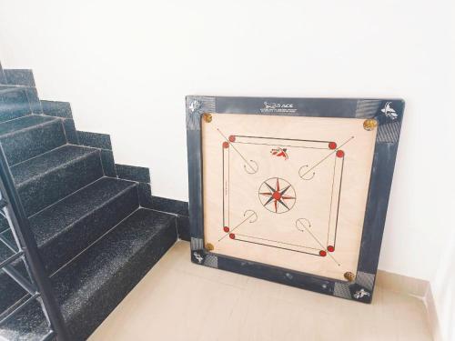 a door with a wheel on it next to some stairs at White House in Hosūr