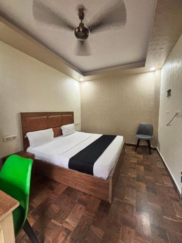 a bedroom with a bed with a ceiling at Kerala Homes Near Nizamuddin in New Delhi