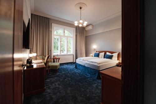 Postel nebo postele na pokoji v ubytování hideauts hotels Villa R