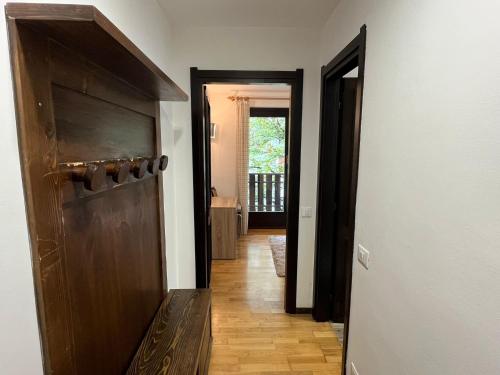 a hallway with a door leading into a room at Apartment Al Parco by Interhome in Carisolo