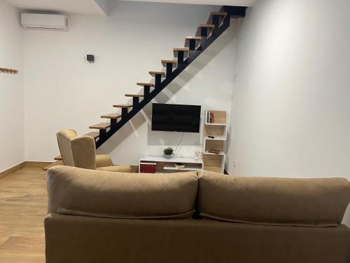 Μια τηλεόραση ή/και κέντρο ψυχαγωγίας στο Apartamento Deluxe Cantillana