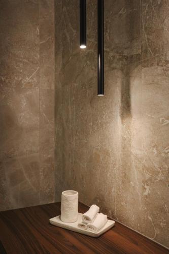 a bathroom with a roll of toilet paper on a counter at Maison Aimée in Han-sur-Lesse