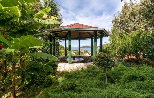 a gazebo in the middle of a garden at Nice Home In Supetarska Draga With Wifi in Supetarska Draga