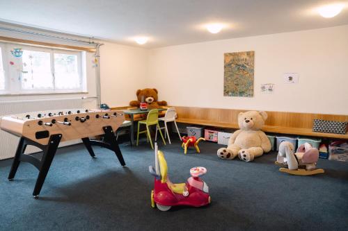 a room with a table and stuffed animals in it at Hotel & Restaurant Nollen in Hosenruck