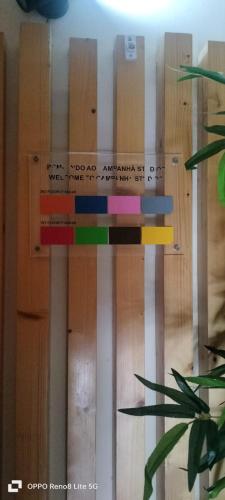 a wooden wall with a sign on it at Brown Porto Apart in Porto