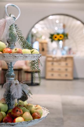 a display of fruit on a cake stand in a room at Hotel & Restaurant Nollen in Hosenruck
