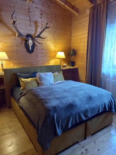 Кровать или кровати в номере Alpenchalet am Golfplatz