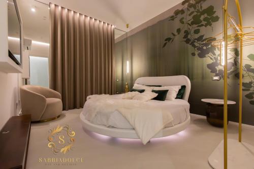 Ένα ή περισσότερα κρεβάτια σε δωμάτιο στο Sabbiadolce