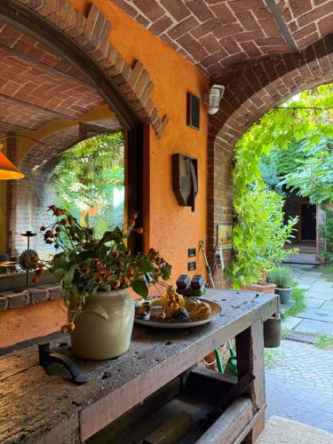 an outdoor table with a plate of food on it at La casa Arancione in Boves
