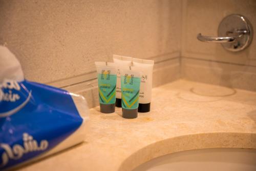 a pair of toothbrushes sitting on a bathroom counter at جناح بانورامي in Jeddah