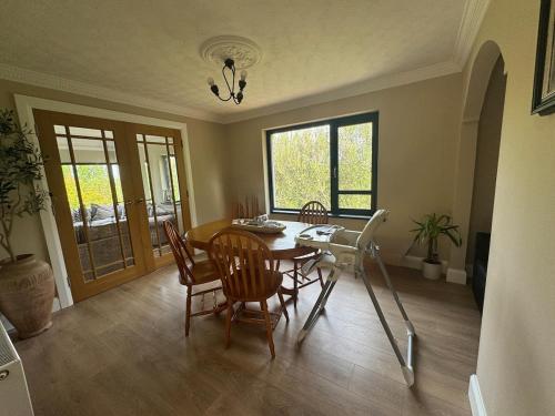 a dining room with a table and chairs at Riversdale Road Tyrone Omagh Fermanagh 