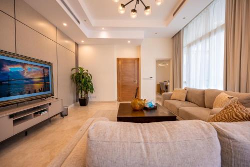 a living room with a couch and a tv at جناح بانورامي in Jeddah