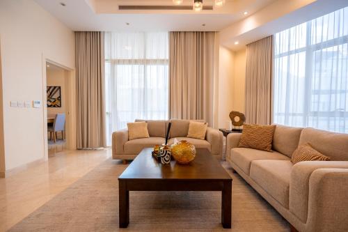 a living room with a couch and a table at جناح بانورامي in Jeddah