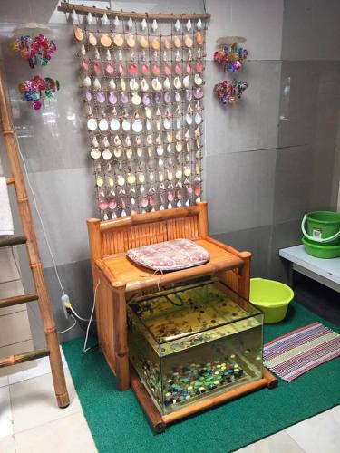 a display of beads in a glass case in a room at Karancho Beach House in Mactan