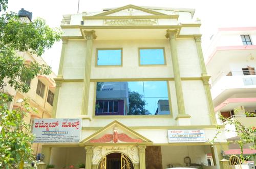 a building with a large window on top of it at Athasri Hotel Cubbon Road in Bengaluru