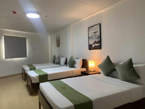 Katil atau katil-katil dalam bilik di Wjv Inn Mia Hotel Maribago