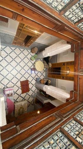 an overhead view of a kitchen with a tile floor at dar ben issa in Fez